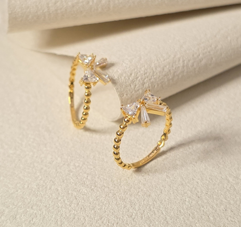 Nhẫn Nơ Đá Trắng Đai Bi Trơn 16K